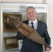 Auctioneer Colin Young With The Aboriginal Broad Shield Which Sold For £30,000