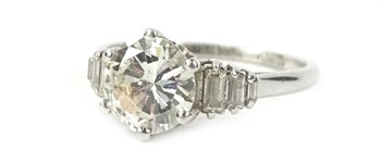 Lot 1 A platinum diamond ring, with round brilliant cut diamond